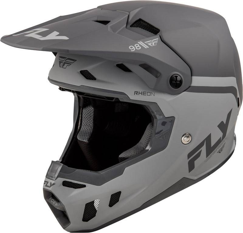 Motocrosshelm von FLY RACING in Schwarz-Grau mit aerodynamischem Design und Visier, geeignet für Offroad-Rennen.