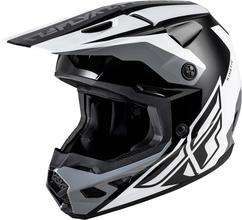 Motocrosshelm FLY RACING Kinetic Crest in Schwarz-Weiß-Grau, mit Visier und Belüftungsöffnungen, auf weißem Hintergrund.