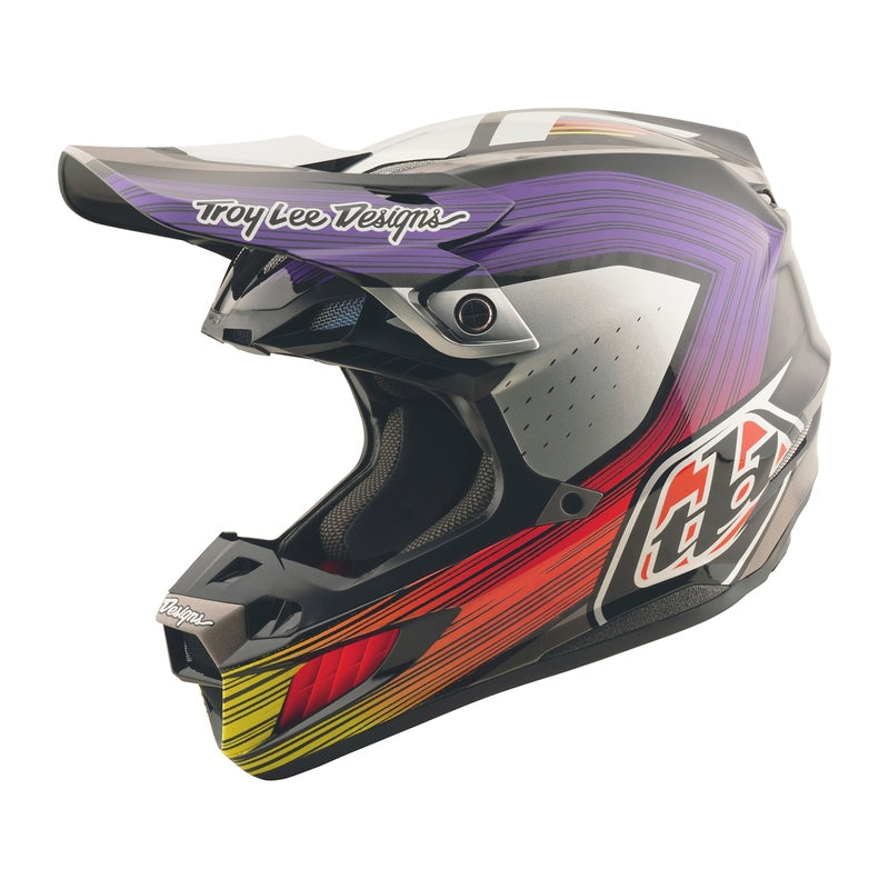 Motocrosshelm TROY LEE DESIGNS Se5 Carbon Stripes in Schwarz und Violett mit futuristischem Design.