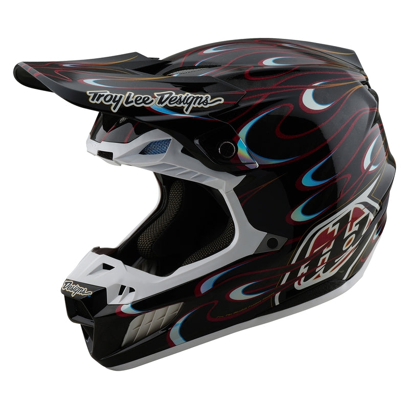 Motocrosshelm Troy Lee Designs SE5 Carbon Torched in Schwarz und Rot mit belüftetem Design und visier.