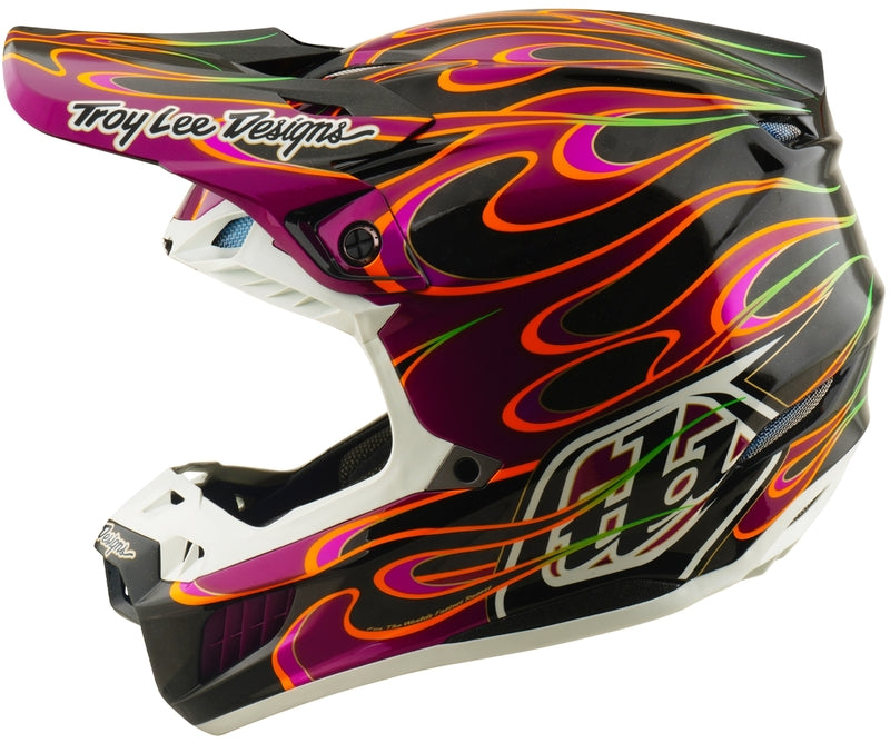Troy Lee Designs Se5 Carbon MIPS Motocrosshelm in Schwarz und Violett mit auffälligem Design, Schutz und Belüftung.
