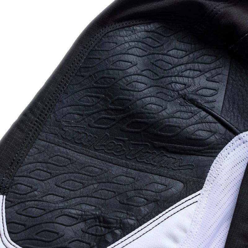 Troy Lee Designs Se Pro Jugend MX-Hose Salvo in Schwarz und Weiß, strapazierfähiges Motorradhose-Design für junge Fahrer