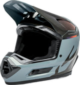 Motocrosshelm iXS Trigger MX 1.0 MIPS in Grau-Schwarz, mit Visier und Belüftungsöffnungen, auf einem schwarzen Hintergrund.