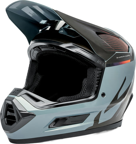 Motocrosshelm iXS Trigger MX 1.0 MIPS in Grau-Schwarz, mit Visier und Belüftungsöffnungen, auf einem schwarzen Hintergrund.