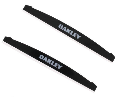 Schwarzes OAKLEY Airbrake Mud Flap Kit Paar, Ersatzteile für Brillen, zeigt die Schutzbleche in einem Produktbild.
