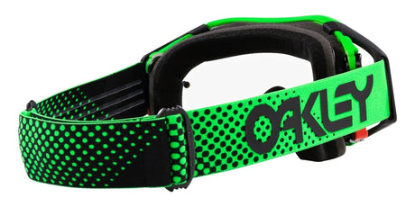 OAKLEY Airbrake MX-Brille mit grünen Rahmen und klarem Glas, perfekt für Motocross, auf einem neutralen Hintergrund.