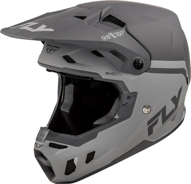 Motocrosshelm von FLY RACING in Schwarz-Grau mit aerodynamischem Design und Visier, geeignet für Offroad-Rennen.