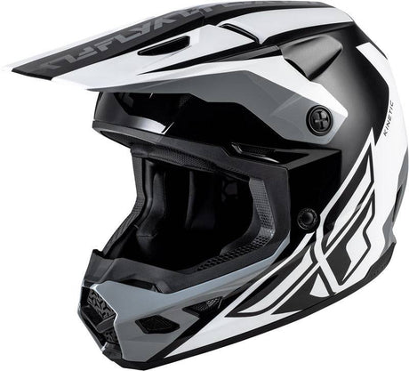 Motocrosshelm FLY RACING Kinetic Crest in Schwarz-Weiß-Grau, mit Visier und Belüftungsöffnungen, auf weißem Hintergrund.