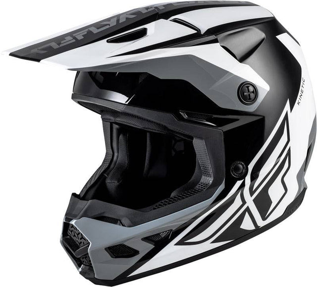 Motocrosshelm FLY RACING Kinetic Crest in Schwarz-Weiß-Grau, mit Visier und Belüftungsöffnungen, auf weißem Hintergrund.