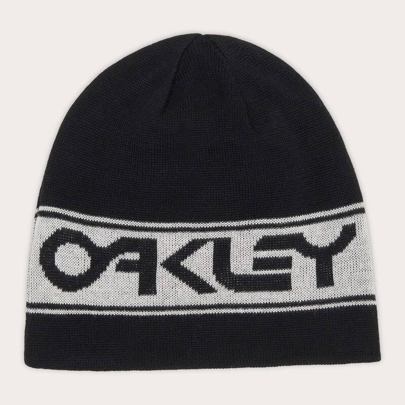 OAKLEY TNP Wendbare Mütze in Schwarz, Freizeitbekleidung, beidseitig tragbar, aus weichem Material, zeigt das OAKLEY Logo.