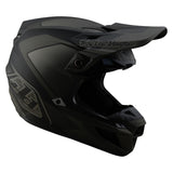 Schwarzer Troy Lee Designs Se5 Composite Mono Motocrosshelm mit Visier und Belüftung, Schutz und sportliches Design.