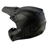 Schwarzer Troy Lee Designs SE5 Composite Mono Motocrosshelm mit Visier und Belüftungsöffnungen, für Offroad-Fahrten.