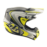 Motocrosshelm von TROY LEE DESIGNS GP Pro Crossover in Grau und Gelb, zeigt stylisches Design und robusten Schutz.
