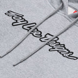 Grauer, melierter Troy Lee Designs Zip-up Signature Hoodie aus Freizeitbekleidung, mit Kapuze und Taschen.