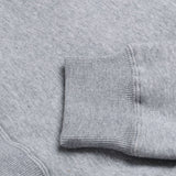 Graue, melierte Troy Lee Designs Zip-up Signature Hoodie aus Freizeitbekleidung, mit Kapuze und Reißverschluss.