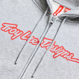 Grauer und rote Troy Lee Designs Zip-up Signature Hoodie aus bequemer Freizeitbekleidung, mit Kapuze und Reißverschluss.