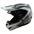 Motocrosshelm von Troy Lee Designs GP Shutter in Grau und Weiß mit Schutzvisier und Belüftung für Offroad-Fahrten
