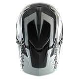 Motocrosshelm von TROY LEE DESIGNS in Grau und Weiß, sportliches Design, Schutzhelm für Offroad und Motocross.