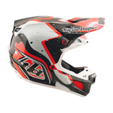Troy Lee Designs Se5 Carbon Motocrosshelm in Schwarz und Rot mit Visier und Belüftungsöffnungen, leichter Carbonaufbau.