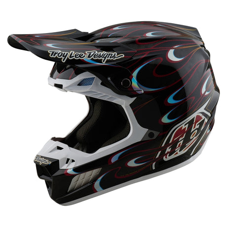 Motocrosshelm Troy Lee Designs SE5 Carbon Torched in Schwarz und Rot mit belüftetem Design und visier.