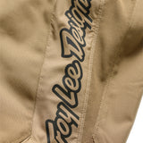 Troy Lee Designs GP Pro MX-Hose Mono Sienna, robuste Motorradhose mit schützender Passform und orange-braunem Design.