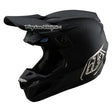 Schwarzer Troy Lee Designs Se5 Carbon Mono Motocrosshelm mit aerodynamischem Design und verstellbarer Visieröffnung.