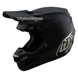 Schwarzer Troy Lee Designs Se5 Carbon Mono Motocrosshelm mit aerodynamischem Design und verstellbarer Visieröffnung.