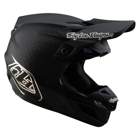 Schwarzer Troy Lee Designs Se5 Carbon Mono Motocrosshelm mit sichtbarer Belüftung und Visier, für den Offroad-Einsatz.