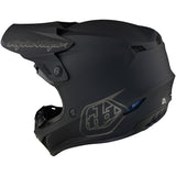 Schwarzer Troy Lee Designs GP Mono Jugend Motocrosshelm mit robustem Design und Belüftungssystem, auf einem weißen Hintergrund.