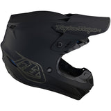 Schwarzer Troy Lee Designs GP Mono Jugend Motocrosshelm mit Belüftungsöffnungen und Visier, für junge Fahrer.