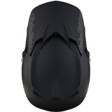 Schwarzer Troy Lee Designs GP Mono Jugend Motocrosshelm auf einem Motorradhelm-Display, detailreiche Sichtbarkeit.