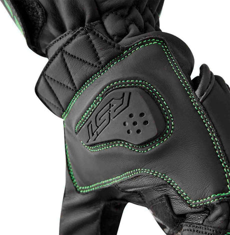 Schwarze RST S1 Motorradhandschuhe mit grünen Flo-Details, sportliches Design und robuste Handprotektoren.