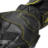 Schwarze RST S1 Motorradhandschuhe mit gelben Akzenten und Flo-Design, aus robustem Material, für sicheren Motorradsport.