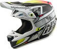 Troy Lee Designs Se5 Carbon Mips Motocrosshelm in Weiß, mit Innenfutter und aerodynamischem Design, auf einem Motorradhelm.