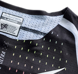 Schwarze TROY LEE DESIGNS MX-Jersey Se Ultra Proton mit stylischem Design und bequemem Schnitt, auf einem weißen Hintergrund.
