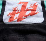 Troy Lee Designs GP Pro MX-Hose Roller in Schwarz und Petrol, robustes Werkzeug für die Lagerung von Motorradhosen.