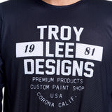 Troy Lee Designs GP Pro Air MX-Jersey in Seal Schwarz, atmungsaktive Motorradtrikot mit kurzen Ärmeln und TROY LEE DESIGNS Logo