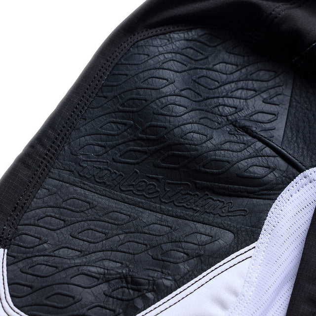 Troy Lee Designs Se Pro Jugend MX-Hose Salvo in Schwarz und Weiß, strapazierfähiges Motorradhose-Design für junge Fahrer