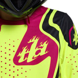 Jugend MX-Jersey Troy Lee Designs GP Pro Roller Flo in Gelb und Fuchsia, mit atmungsaktivem Material und auffälligem Design.