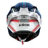 Airoh Integralhelm GP 800 Hurricane in Weiß, Schwarz, Blau und Rot mit visier und Belüftungsöffnungen auf einer Motorradstraße