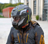 Caberg Klapphelm Duke Evo Move in matt-gun metallic, schwarz-fluo-gelb mit sichtbarem Visier und Belüftungsöffnungen.