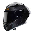 Schwarzer Caberg Helm GP01 Carbon als Integralhelm, mit klarer Visier und aerodynamischem Design.