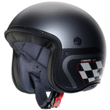 Matte schwarze und metallic-graue Jethelm von Caberg Freeride X Daytona, mit schwarzem und weißem Design, sichtbarer Visieröffnung.