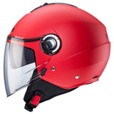 Mattrote Caberg Riviera V4 X Jethelm mit Visier und Belüftung, modernes Design, komfortables Tragegefühl.