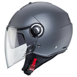 Matt-gun metallic Jethelm von Caberg Riviera V4 X mit klarer Visier und aerodynamischem Design, auf dem Bild sichtbar.