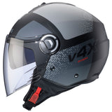 Schwarzgraue Caberg Riviera V4 X Alpha Jethelm mit mattem Finish, sichtbarer Innenpolsterung und Belüftungsöffnungen.
